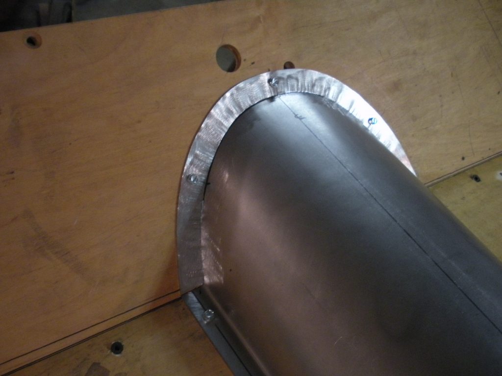 A metal pipe with a piece of tin foil around it.