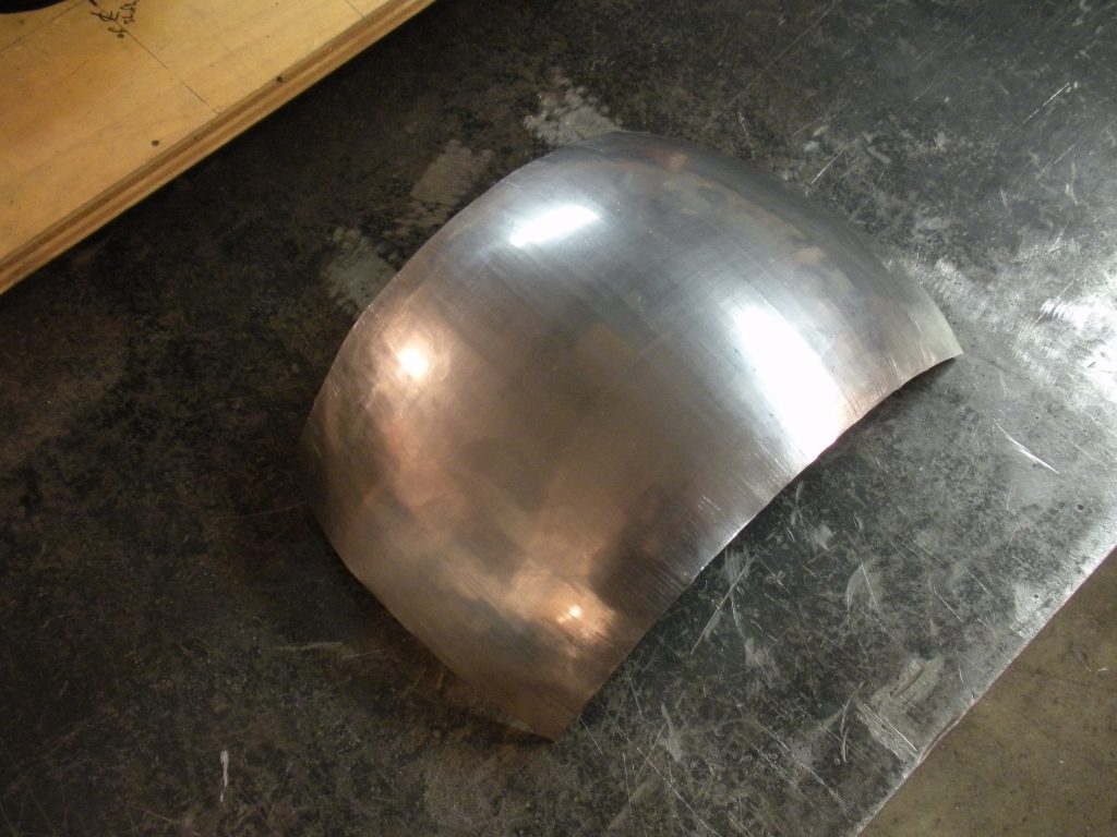 A metal object sitting on top of a table.