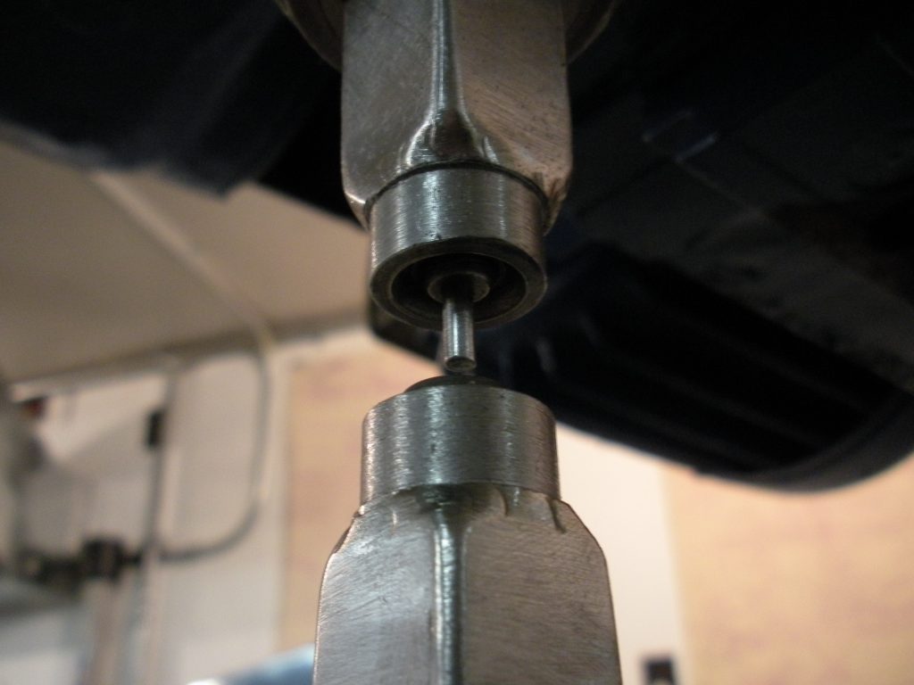 A close up of the head of an industrial drill press.