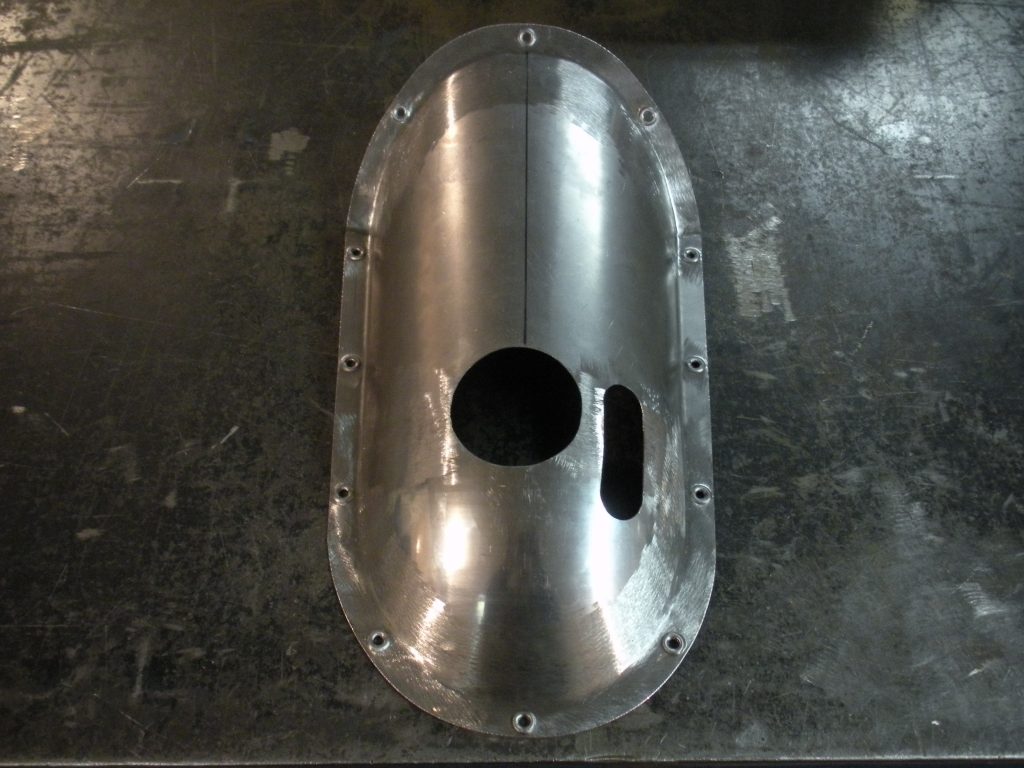 A metal object sitting on top of a floor.
