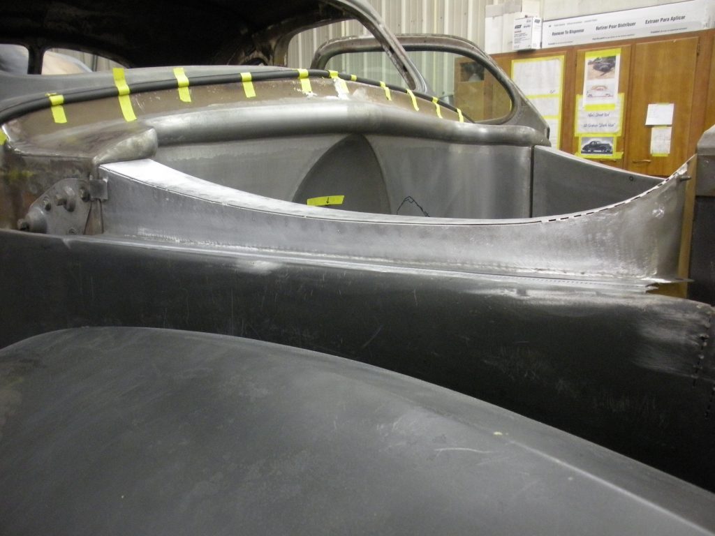 Here's an alt tag for the image: Classic car bodywork in progress.