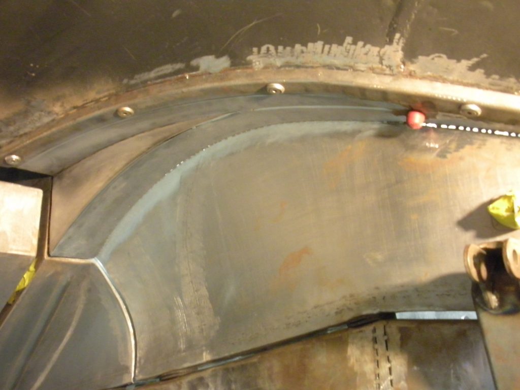 Metal car body panel repair work.