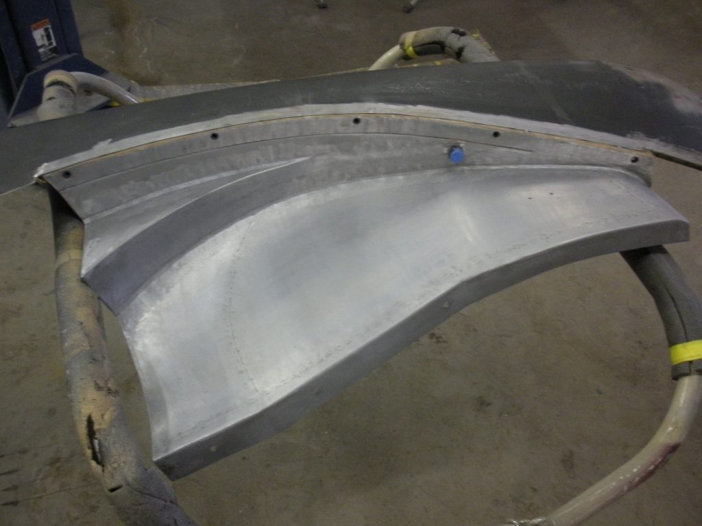 Metal car part in progress.