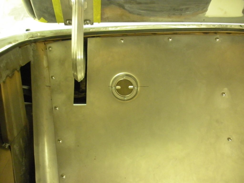 Metal panel with circular cutout.