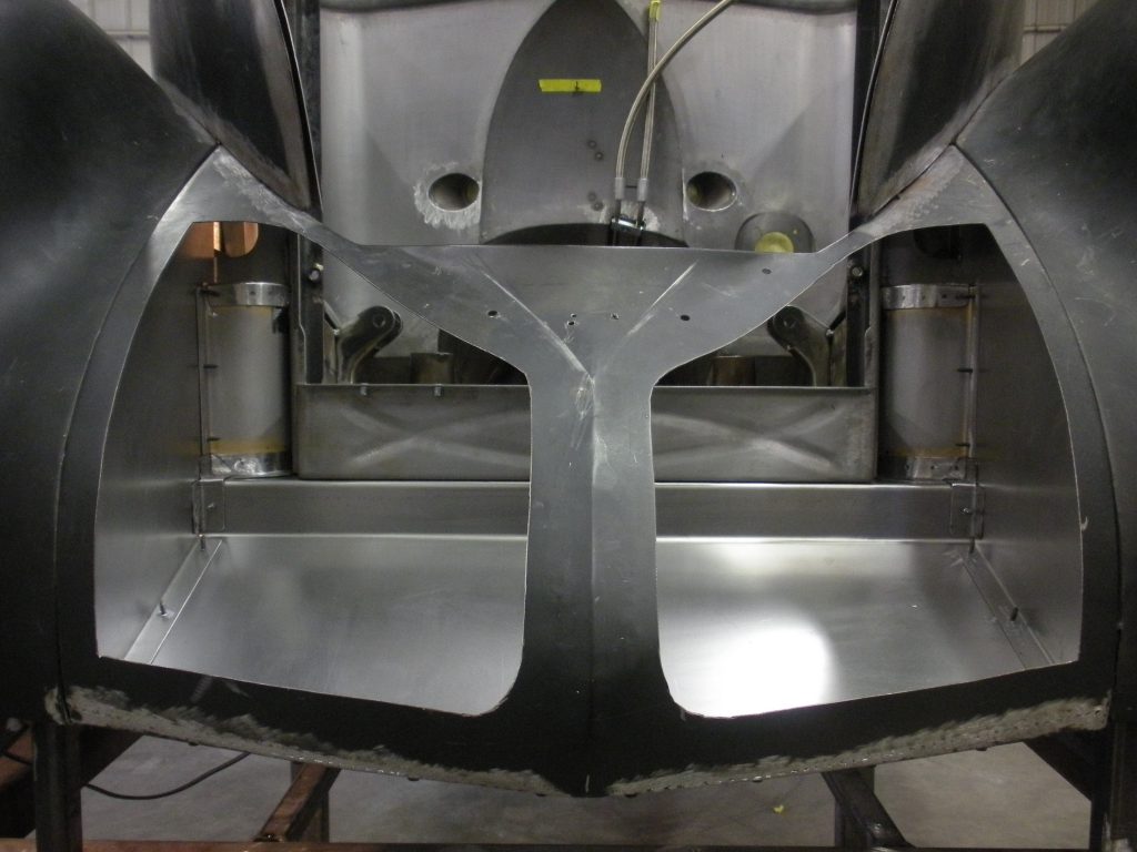 Car body frame under construction.