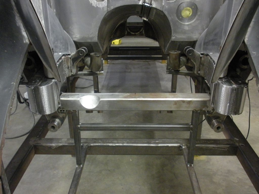 Here's an alt tag for the image: Metal chassis frame in construction.