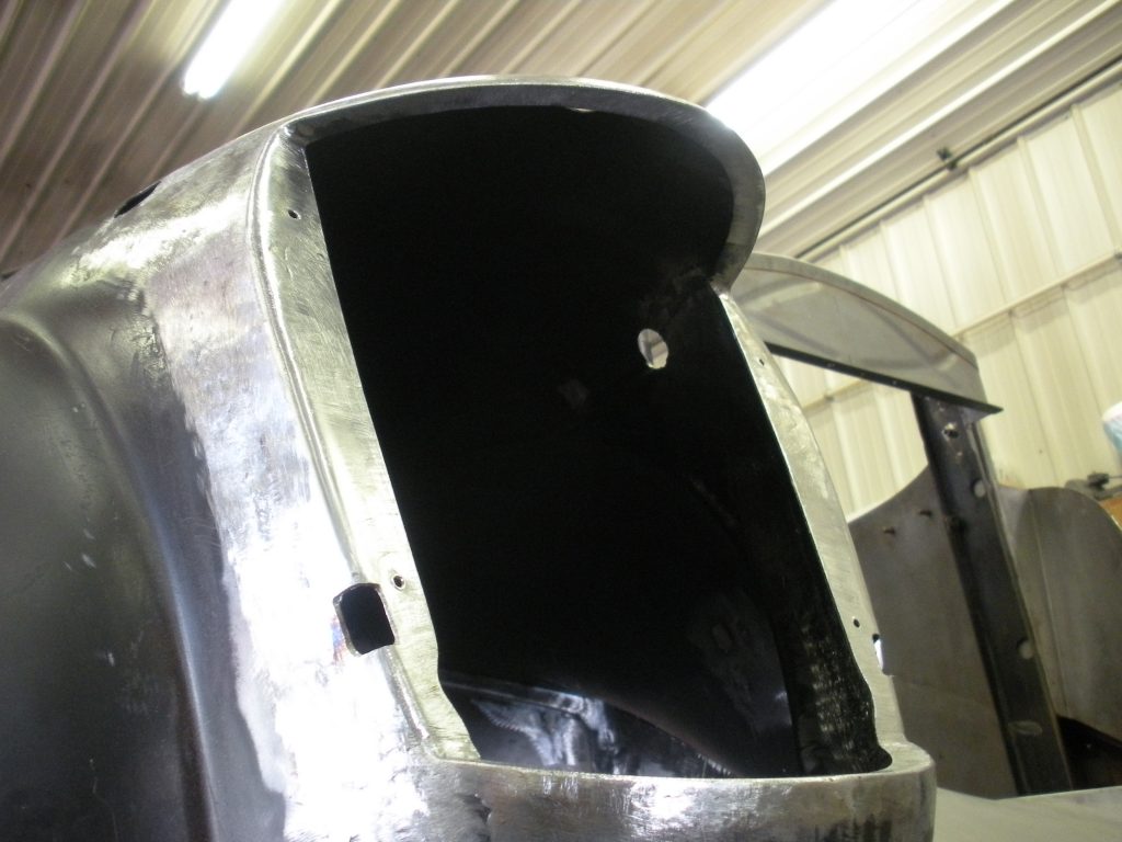 Metal car body panel, under construction.