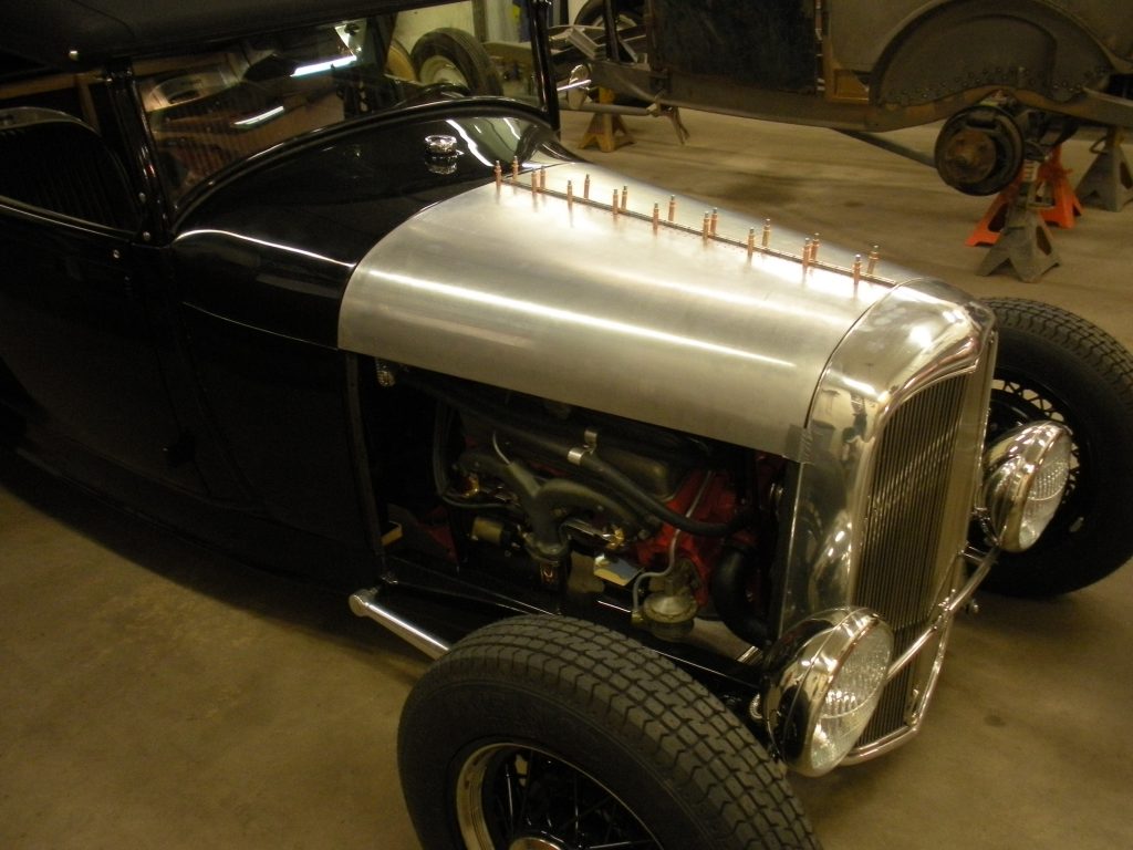 A black and silver car in a garage