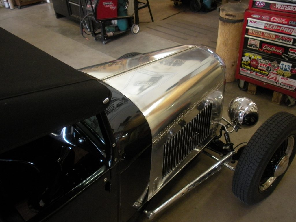 A black and silver car in a garage