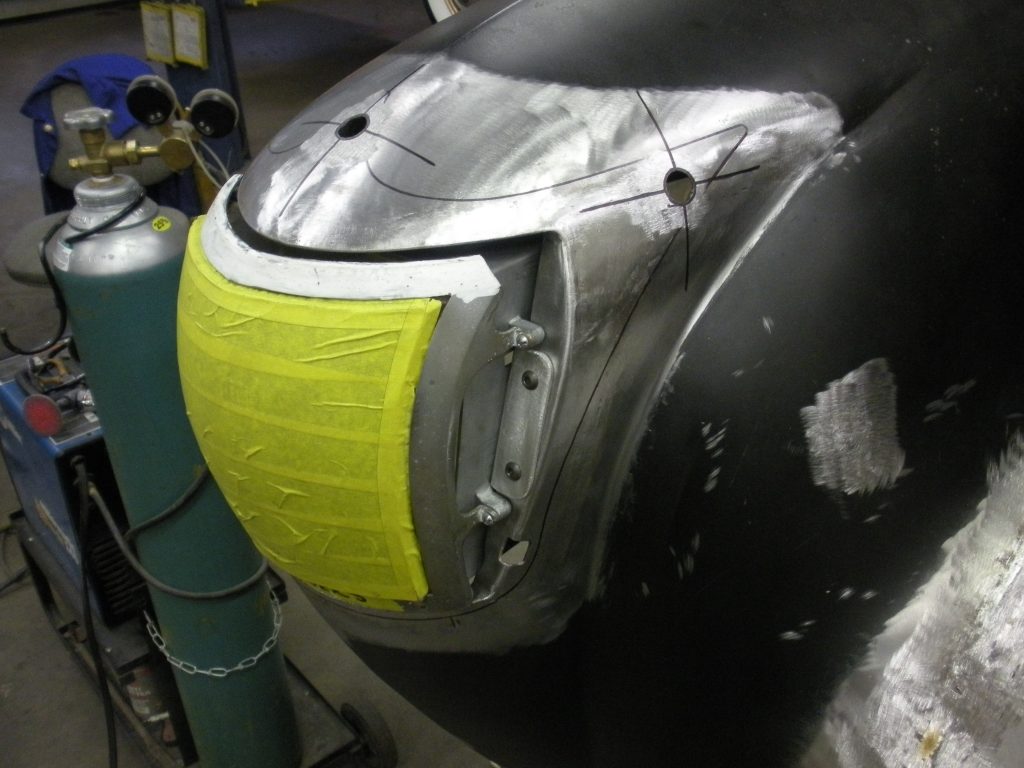 Car body panel repair in progress.