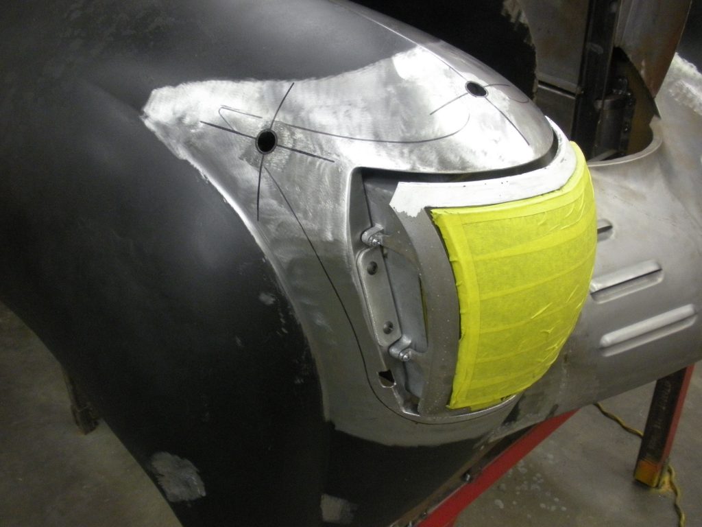 Car body repair: fender light installation.