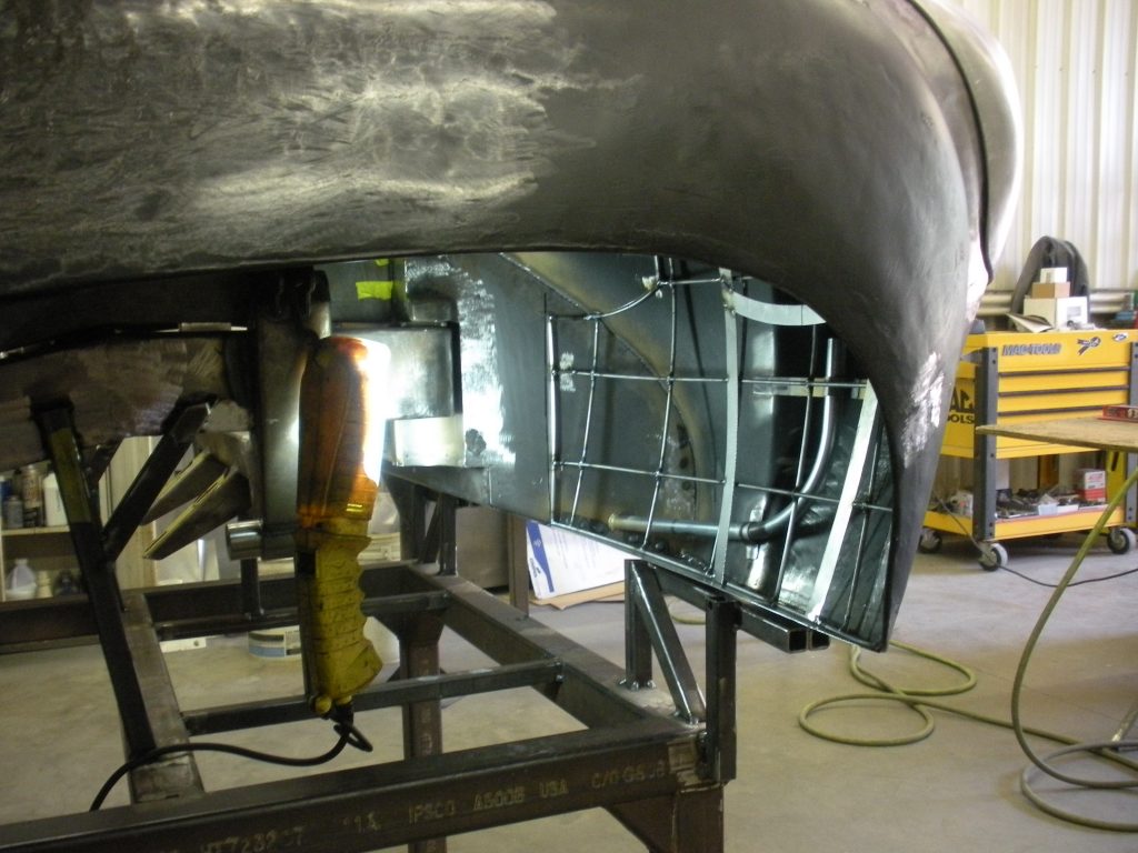 Car body panel welding in progress.