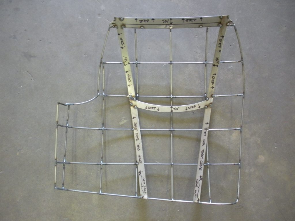 Welded wire frame with measurement markings.