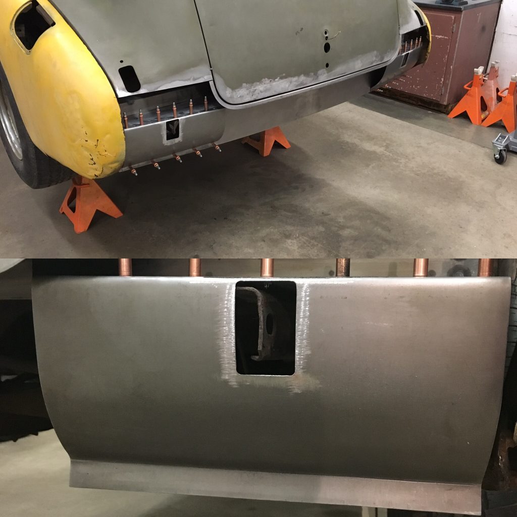 A car that is being worked on in the garage.