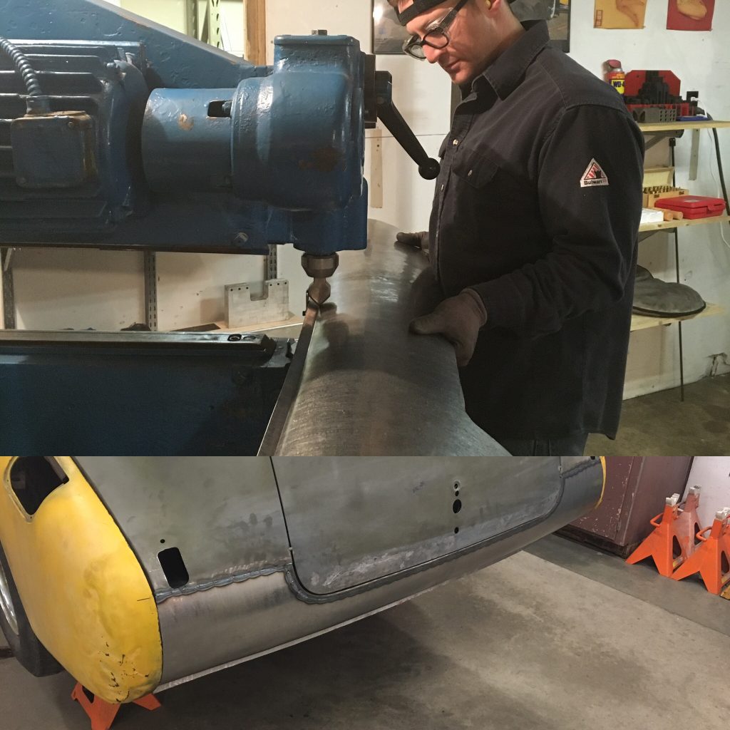 A man working on an airplane in a garage.
