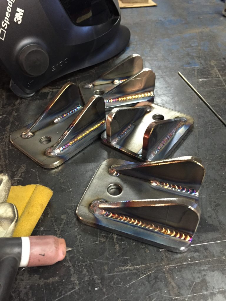 A table with some metal parts on it