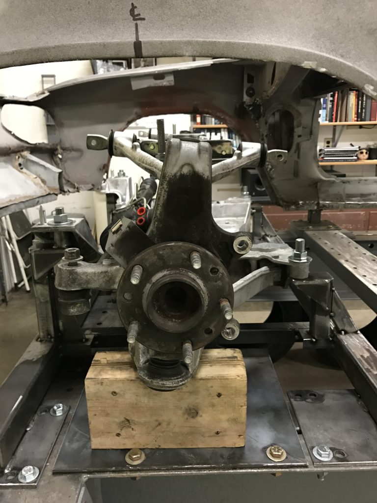 A car that is being worked on in the shop.