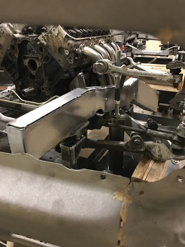 A close up of the engine block and parts.