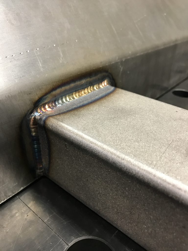 A close up of the seat rail on an escalator