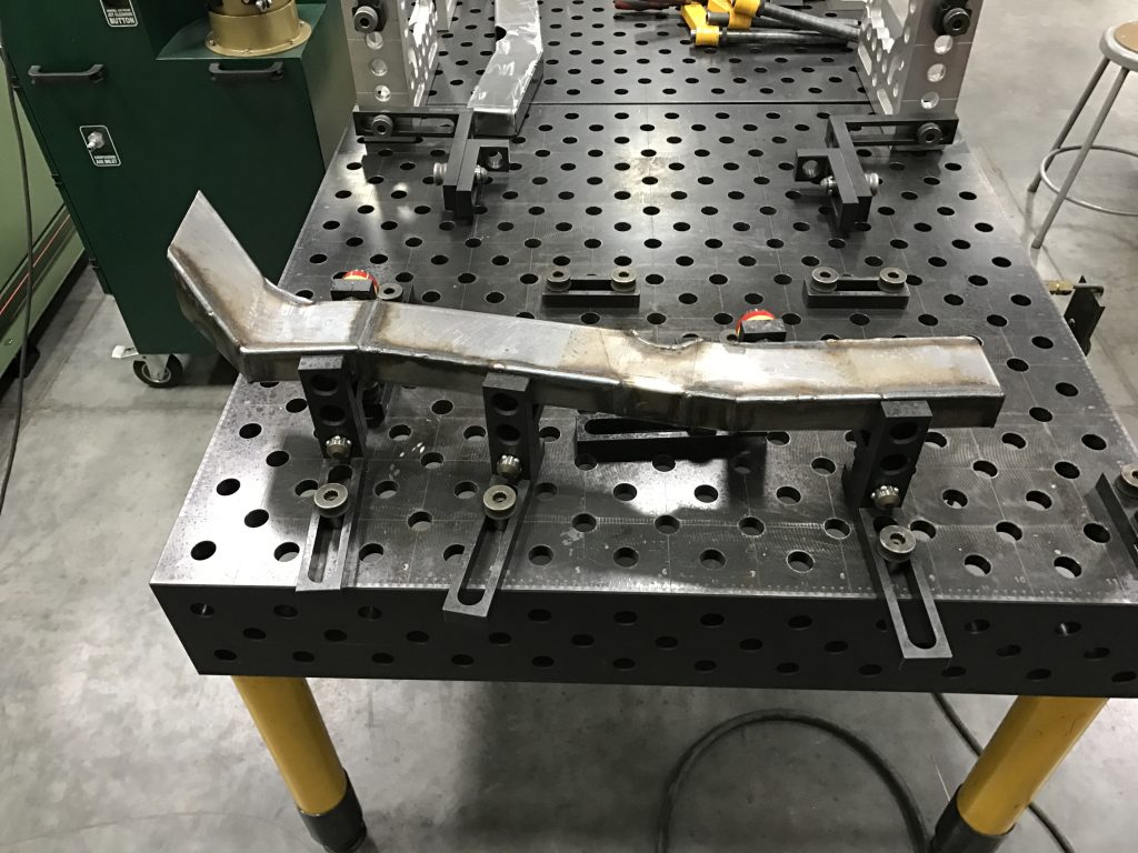 A table with some metal parts on it
