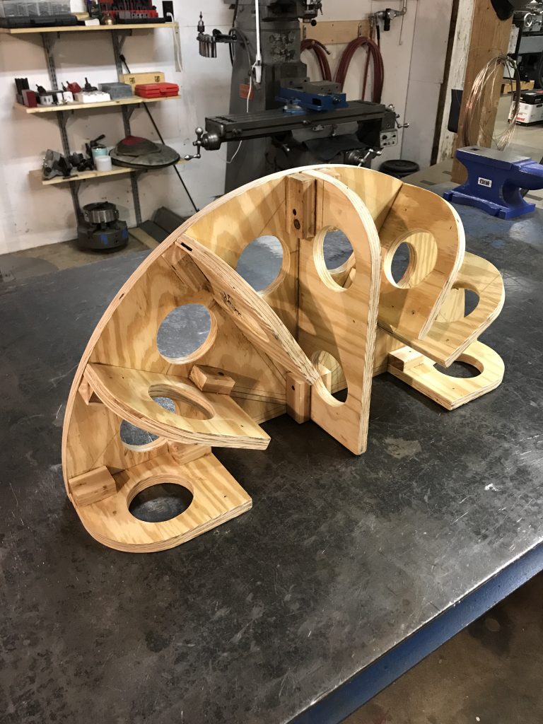 A wooden sculpture sitting on top of a table.