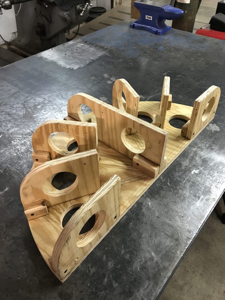 A wooden object sitting on top of a table.