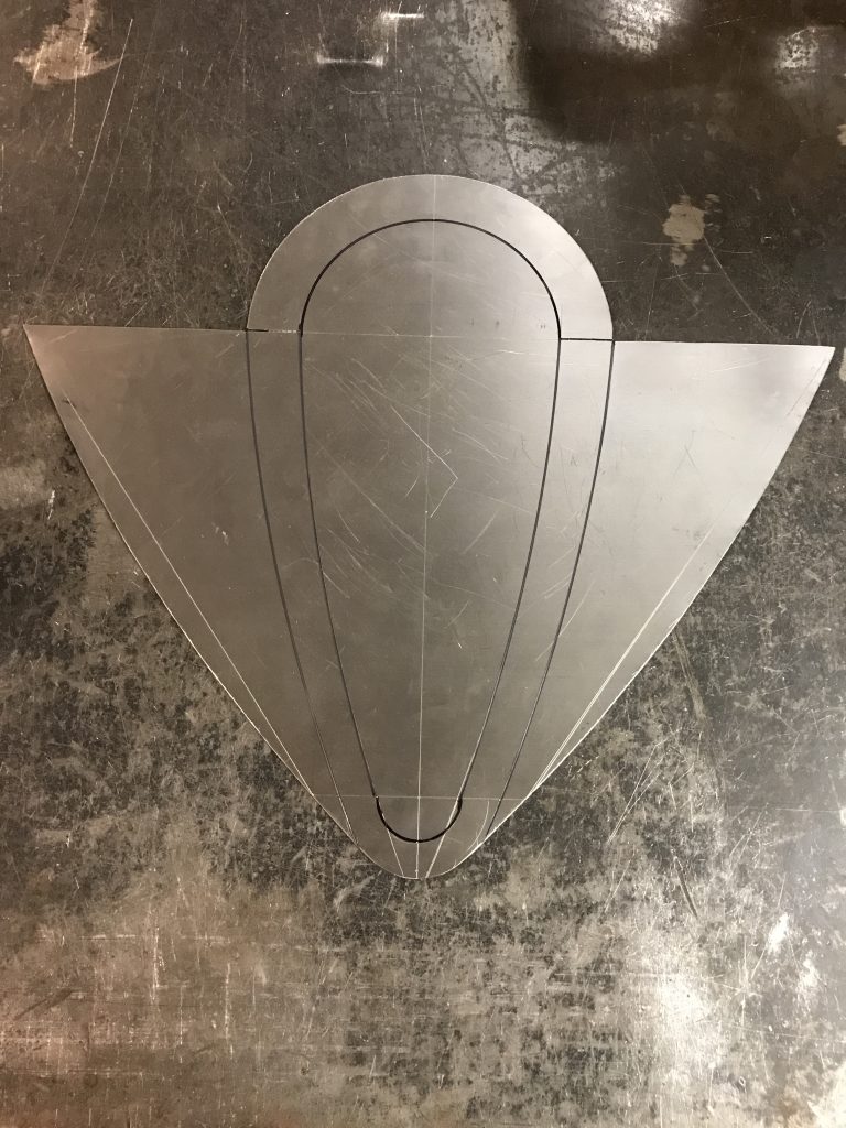 Metal template for curved piece.