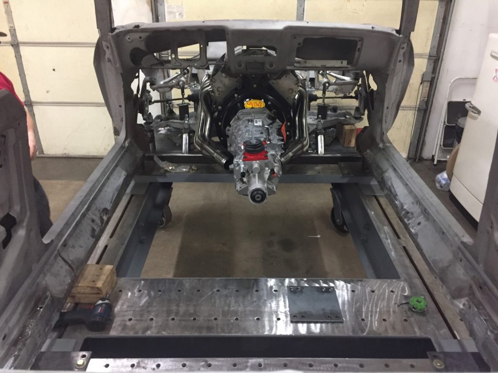 A car is being built in the shop.