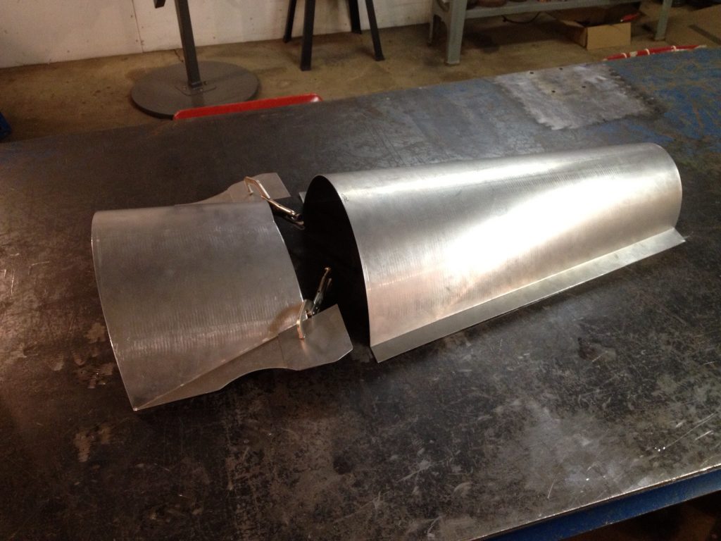 Metal sheet metalwork in progress.