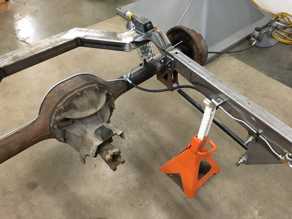 Custom car chassis rear end assembly.