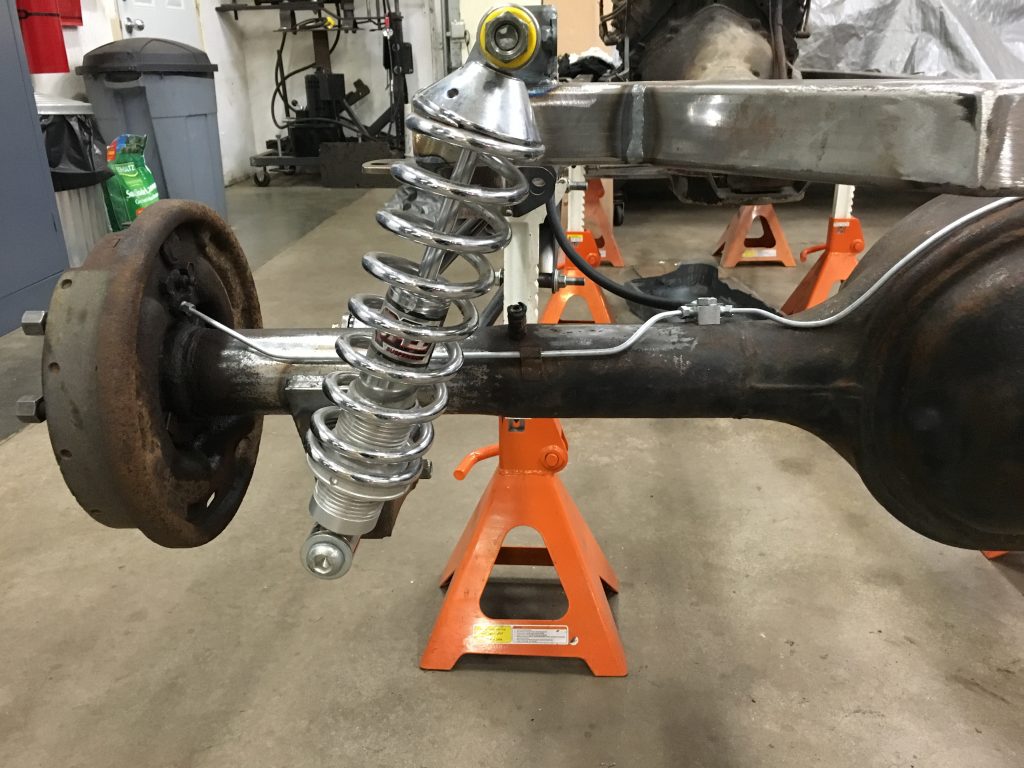 Rear axle with new shock absorber installed.