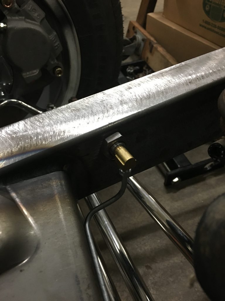 Close-up of a car's metal frame detail.