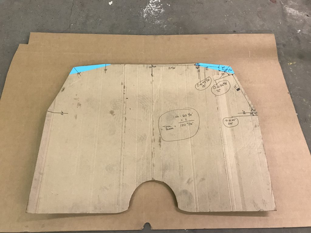 Cardboard template with measurements marked.