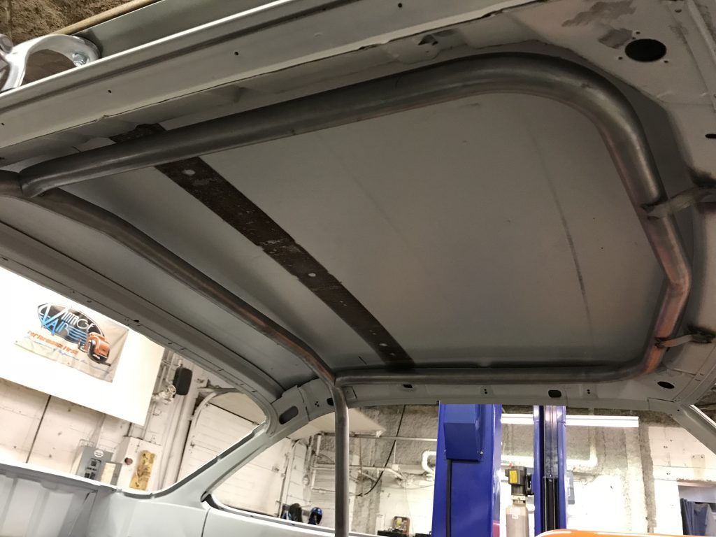 Car interior roll cage installation.