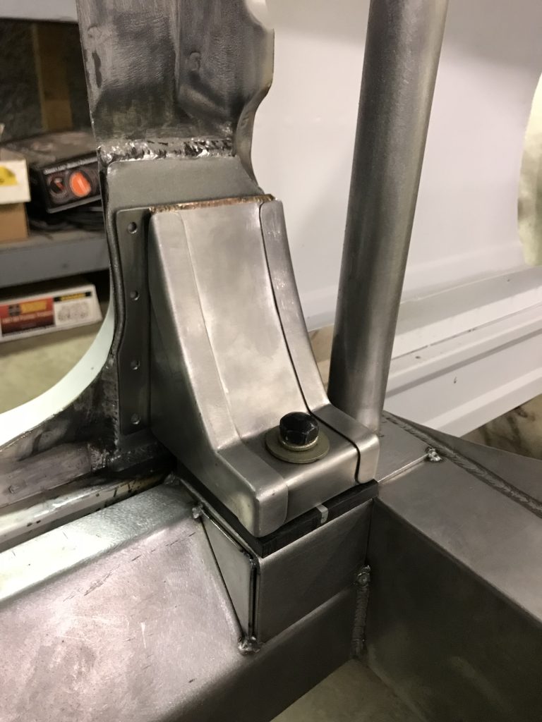 Welded metal frame detail with bolt.