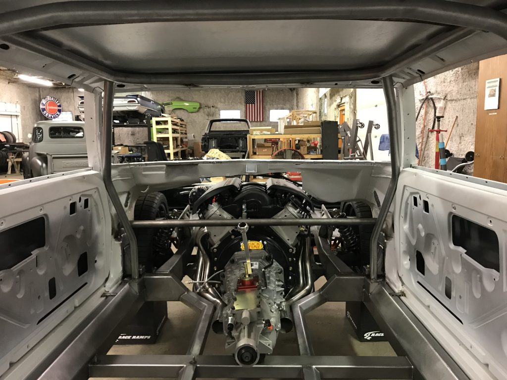 Car chassis with engine installed.